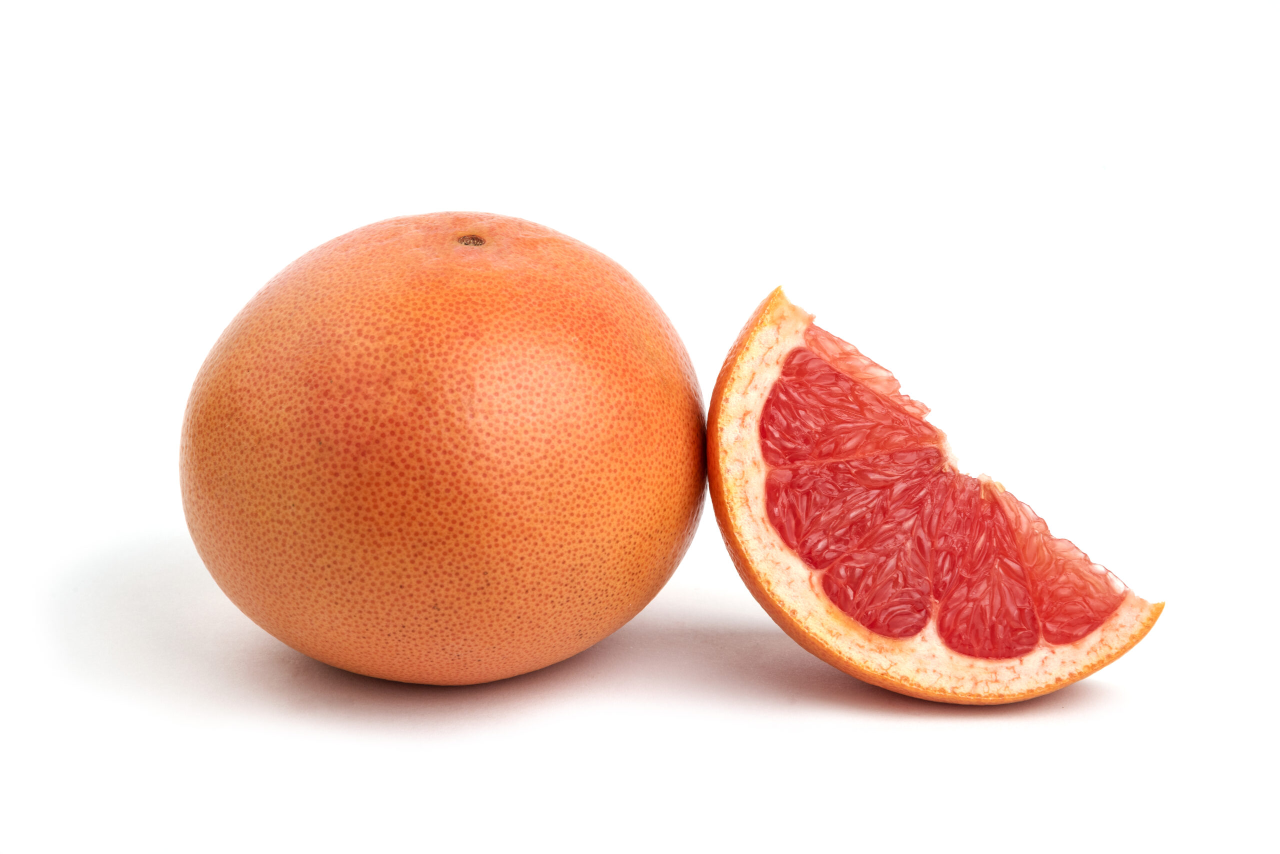 close up photo whole sliced grapefruit isolated white 1 scaled